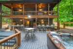Amazing multi-level porches with seating, dining, hot tub and firepit area